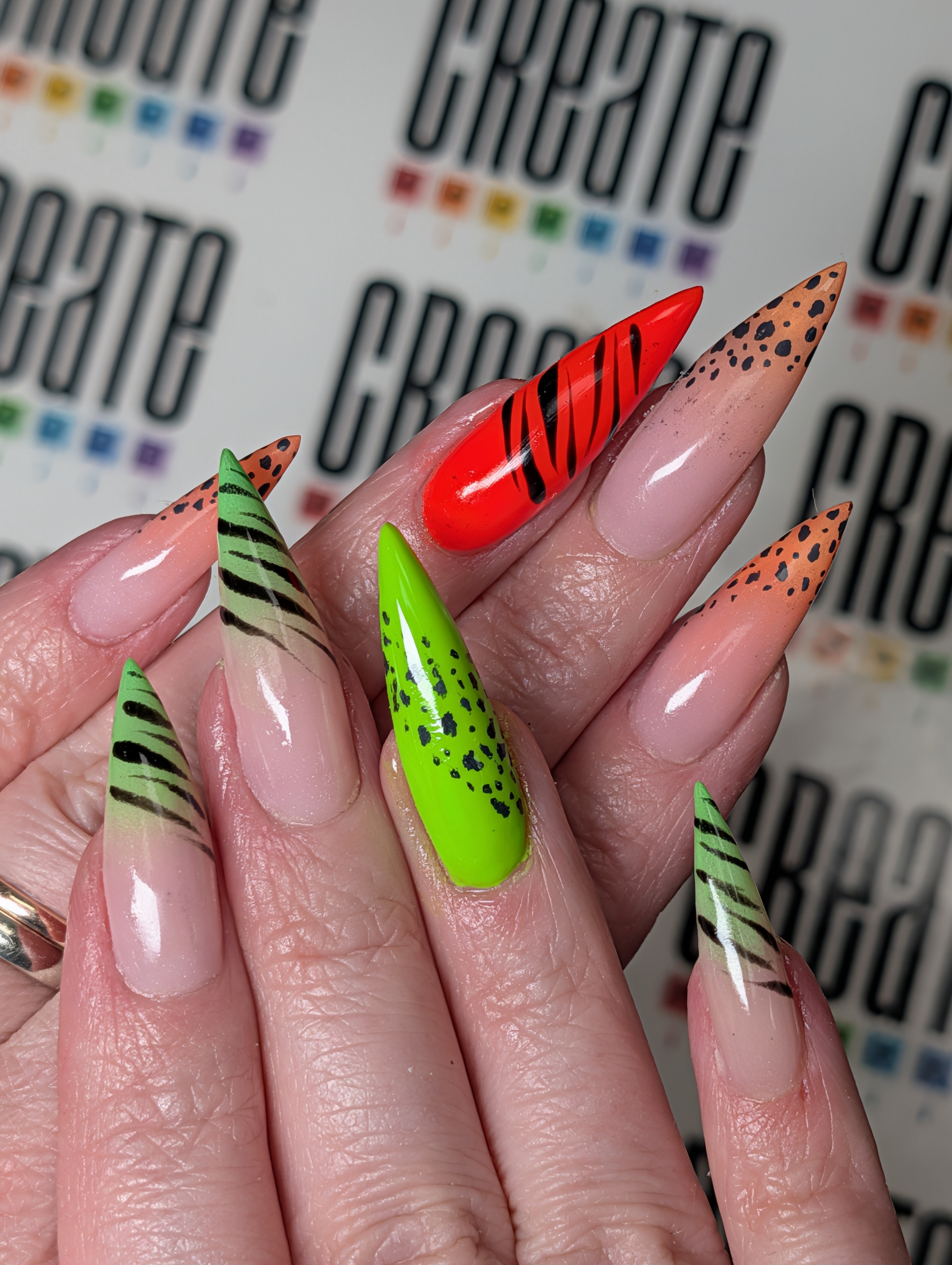 Sculpted long stilettos with hand painted nail art.